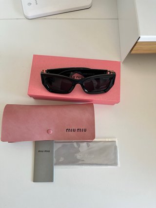 Occhiali da sole Miu Miu donna neri e dorati
