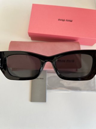 Occhiali da sole Miu Miu donna neri e dorati