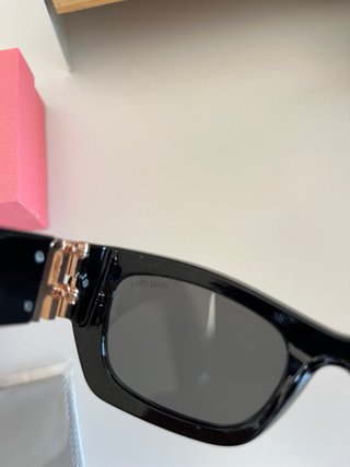 Occhiali da sole Miu Miu donna neri e dorati