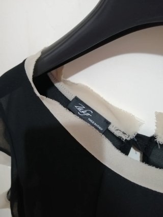 Camicia elegante nera con dettagli beige