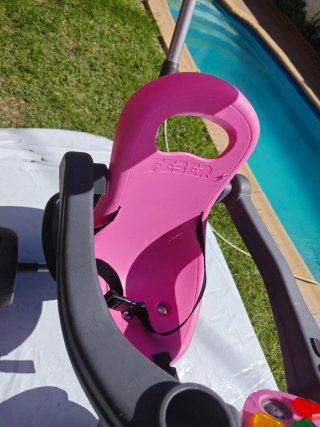 Triciclo infantil rosa con capota