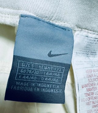 Pantalón chándal Nike beige con logo verde Talla S