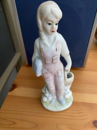 Figuras porcelana antiguas niños pájaro.
