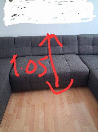 Sofá modular gris con chaise longue