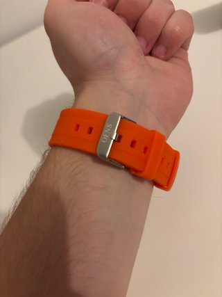 Reloj plateado y naranja NUEVO