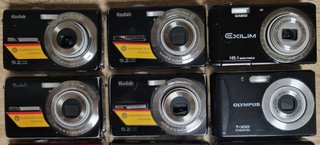 Consegna di fotocamere digitali compatte per ricambi