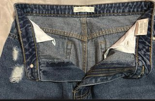 Pantalón vaquero ancho desgastado