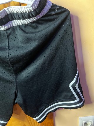 Pantalón Jordan negro y blanco en talla XS.