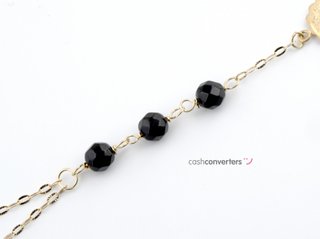manita oro 18k con piedra con onix