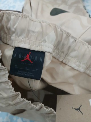 Calças PSG x Jordan bege