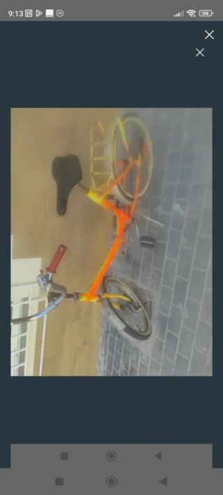 Bicicleta plegable antigua naranja