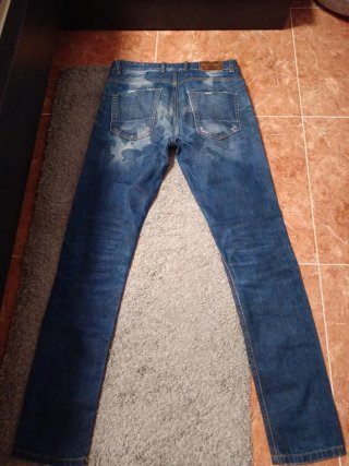 Vaqueros hombre azules desgastados