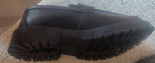 Mocasines negros y blancos con flecos