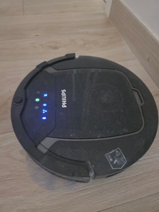 Robot Aspirador Philips con accesorios y caja.