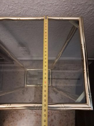 Mesa auxiliar cristal y metal dorado
