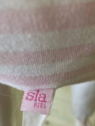 Muñeca de trapo rosa con bufanda