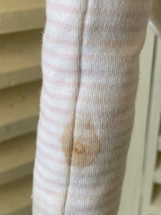 Muñeca de trapo rosa con bufanda