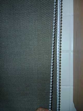 Estor enrollable gris tejido