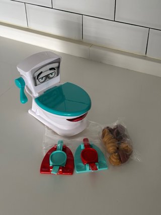 Juguete juego familiar Encesta la Caca Poop Shot