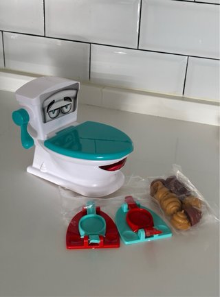 Juguete juego familiar Encesta la Caca Poop Shot