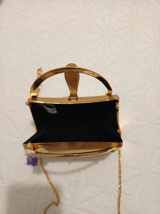 Bolso de fiesta dorado con pedrería