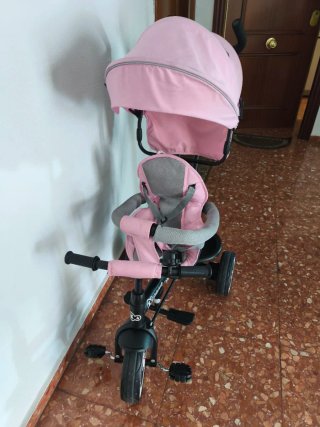 Triciclo infantil rosa con capota