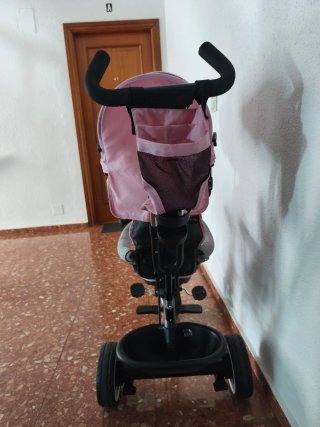 Triciclo infantil rosa con capota