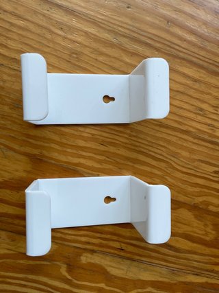 Soportes de pared blancos para auriculares