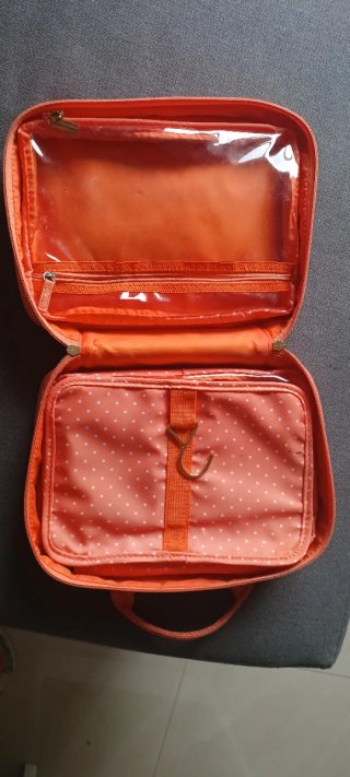 Neceser de viaje naranja lunares