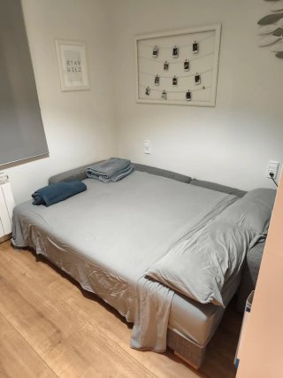 Sofá cama gris de 3 plazas