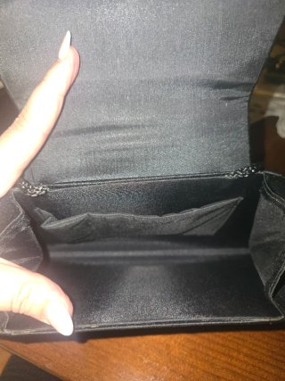 Bolso de fiesta negro con lazo brillante