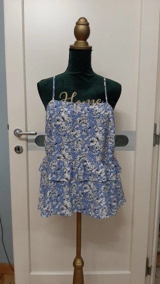 Top con peplo floreale