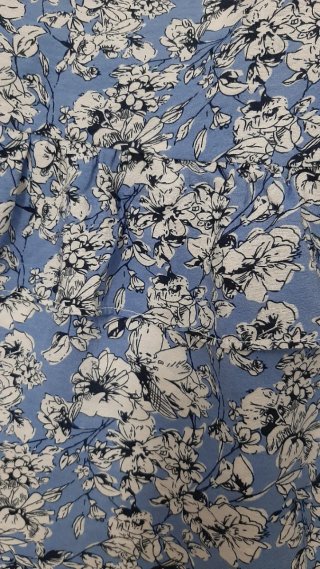 Top con peplo floreale