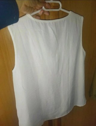 Blusa blanca sin mangas con cremallera Talla L