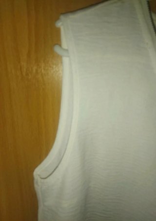 Blusa blanca sin mangas con cremallera Talla L