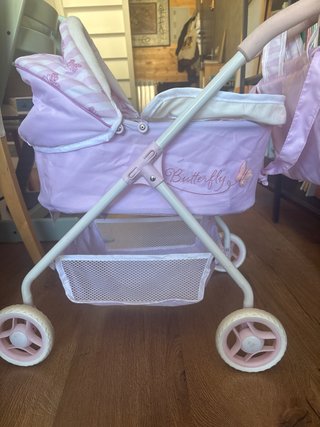 Cochecito de juguete para muñecas