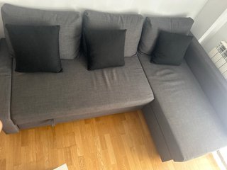 Sofá cama gris de tela