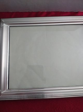 Cornice in argento