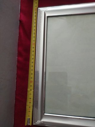 Cornice in argento