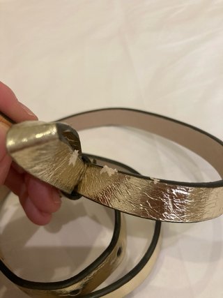 Cinturón dorado con lazo