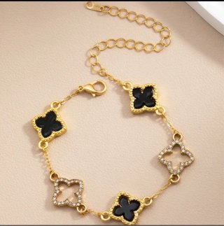 Pulsera tréboles oro y negro
