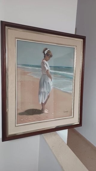 Cuadro de playa con niña..