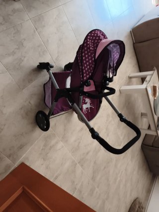 Cochecito de muñecas con unicornio