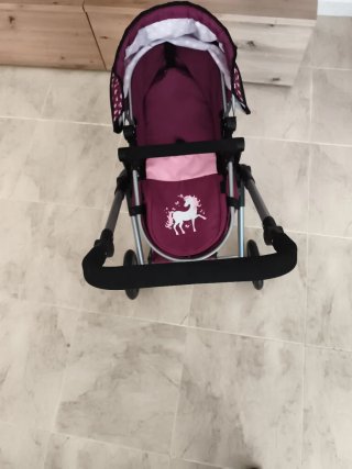 Cochecito de muñecas con unicornio