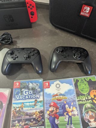 Pack Nintendo switch v2+mandos+micros+9juegos+baul