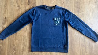 Sudadera DC azul con bolsillo estampado