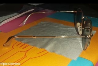 Gafas de sol Ray-Ban doradas y verdes