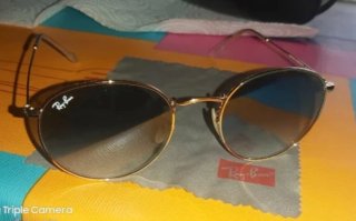 Gafas de sol Ray-Ban doradas y verdes