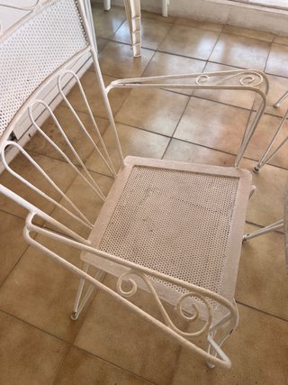 Conjunto mesa de piedra y sillas de forja exterior