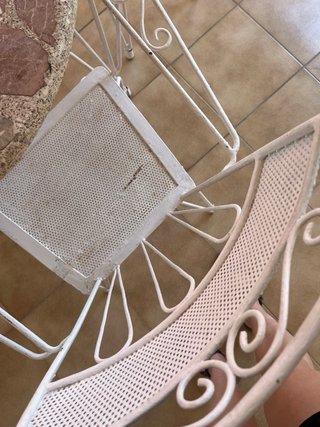 Conjunto mesa de piedra y sillas de forja exterior